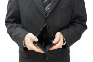 businessman shows empty wallet